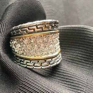 Large Silver tone ring with cz stones and gold trim inset.